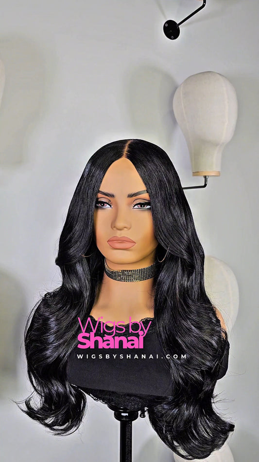 The Luxe – A 100% glue-less, beginner-friendly human hair wig featuring soft, voluminous curls and light layers. Lightweight, breathable, and pre-styled for effortless elegance.