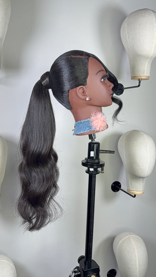 The Silken Sleek wrap-around ponytail styled with soft curls, from Wigs by Shanai’s Luxe Wraps Collection