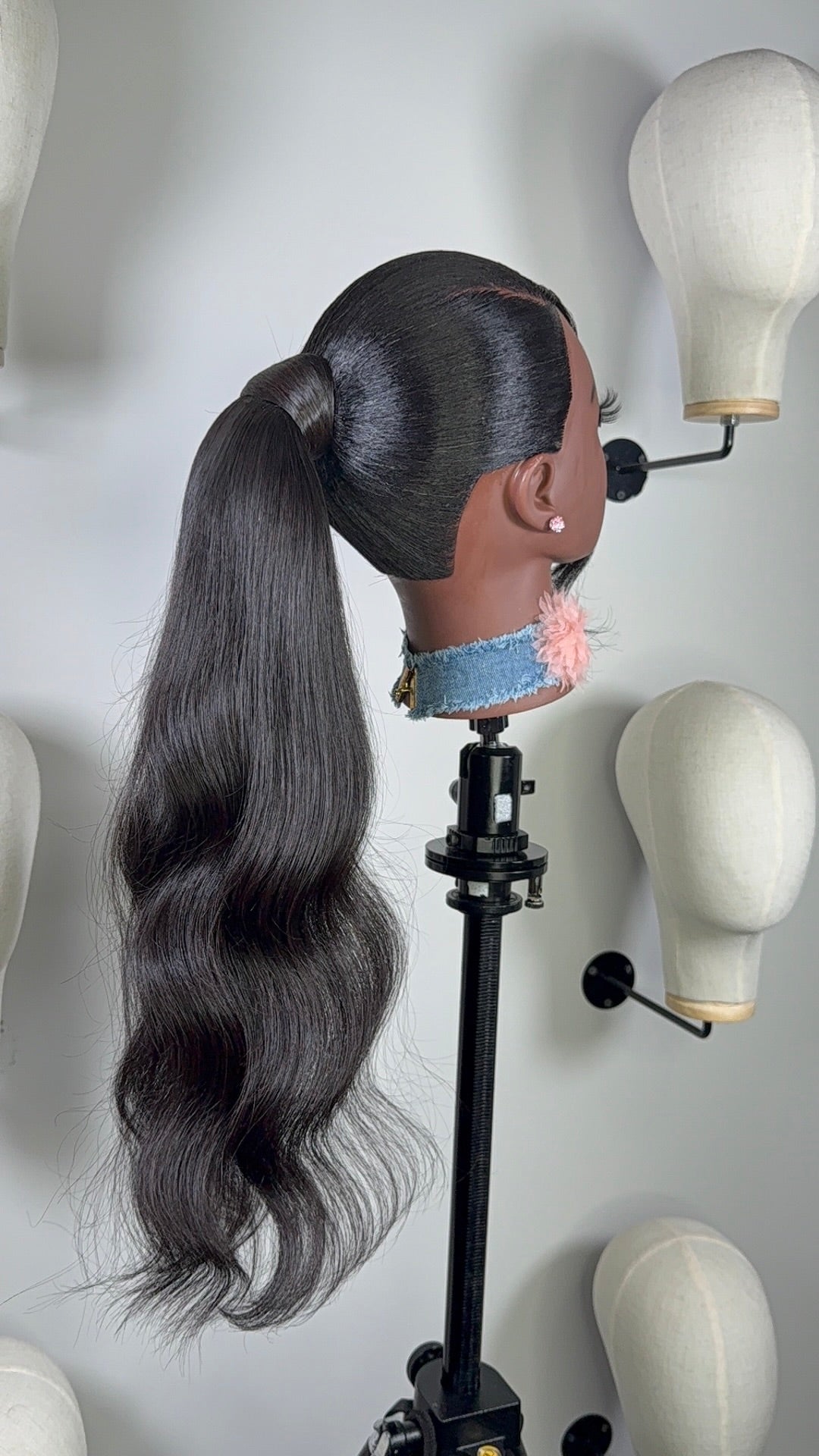 The Silken Sleek wrap-around ponytail styled with soft curls, from Wigs by Shanai’s Luxe Wraps Collection