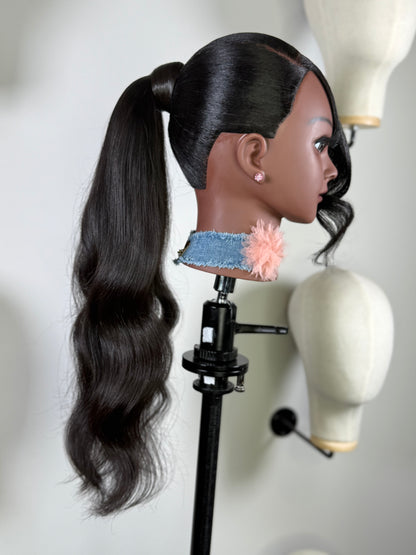 The Silken Sleek wrap-around ponytail styled with soft curls, from Wigs by Shanai’s Luxe Wraps Collection