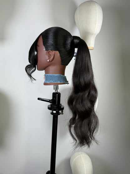 The Silken Sleek wrap-around ponytail styled with soft curls, from Wigs by Shanai’s Luxe Wraps Collection