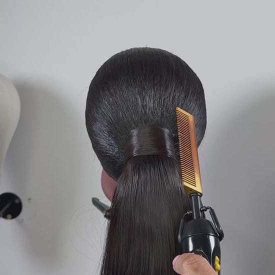 The Silken Sleek wrap-around ponytail styled with soft curls, from Wigs by Shanai’s Luxe Wraps Collection